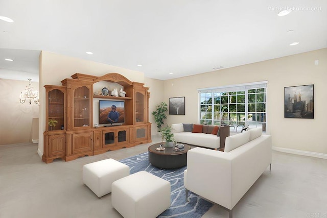 living area featuring recessed lighting, baseboards, and an inviting chandelier