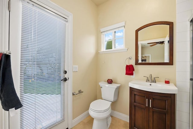 bathroom with vanity, baseboards, and toilet