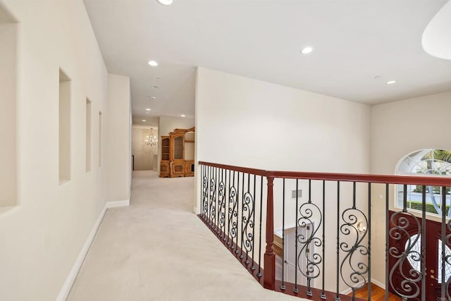 hall with baseboards, carpet flooring, and recessed lighting