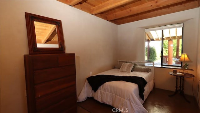 bedroom featuring wood ceiling and beam ceiling
