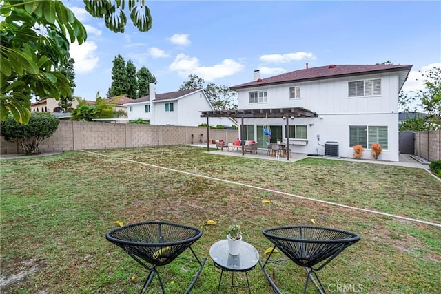 back of house with central AC unit, a patio area, a fenced backyard, a yard, and a pergola