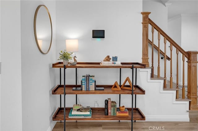 interior space with baseboards and wood finished floors