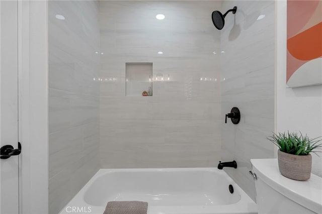 bathroom with toilet and  shower combination