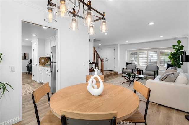 dining area with stairway, baseboards, recessed lighting, and light wood-style flooring