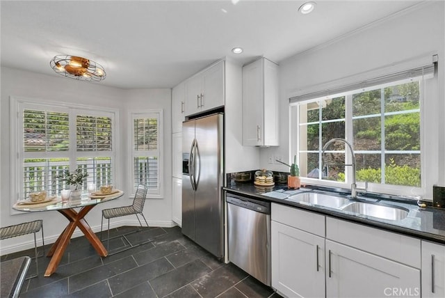 19801 Meadow Ridge Dr Unit 35, Trabuco Canyon, CA 92679 - kitchen with white cabinets, appliances with stainless steel finishes, a sink, recessed lighting, and dark tile patterned flooring