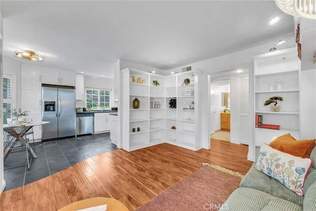 19801 Meadow Ridge Dr Unit 35, Trabuco Canyon, CA 92679 - living area featuring visible vents, recessed lighting, dark wood-style flooring, and built in shelves