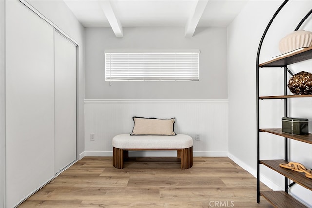 12748 Paramount Blvd, Downey, CA 90242 - sitting room featuring beam ceiling, a wainscoted wall, and light wood-style floors