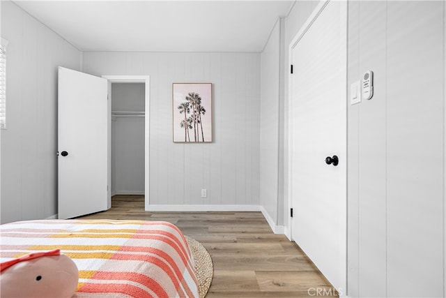 12748 Paramount Blvd, Downey, CA 90242 - bedroom with wood finished floors, a closet, and a walk in closet