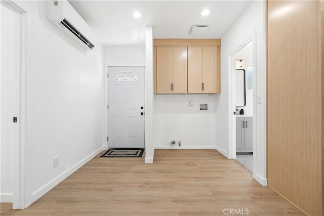 12748 Paramount Blvd, Downey, CA 90242 - washroom with an AC wall unit, cabinet space, hookup for a washing machine, light wood-type flooring, and recessed lighting