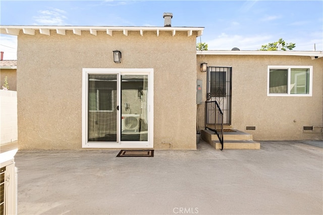 12748 Paramount Blvd, Downey, CA 90242 - back of property with a patio area and stucco siding