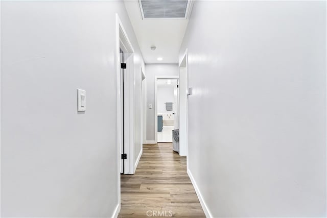 12748 Paramount Blvd, Downey, CA 90242 - hallway with light wood-type flooring and recessed lighting