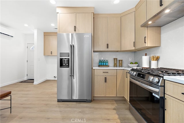 12748 Paramount Blvd, Downey, CA 90242 - kitchen with stainless steel appliances, under cabinet range hood, light brown cabinetry, a wall mounted AC, and light countertops