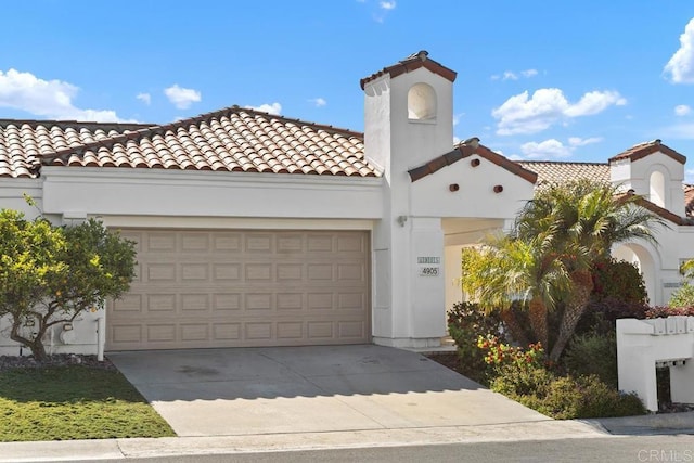 4905 Alicante Way, Oceanside, CA 92056 - mediterranean / spanish-style home featuring driveway, a garage, a tile roof, and stucco siding