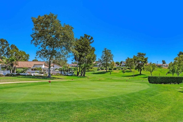 4905 Alicante Way, Oceanside, CA 92056 - surrounding community with a putting area, golf course view, and a yard