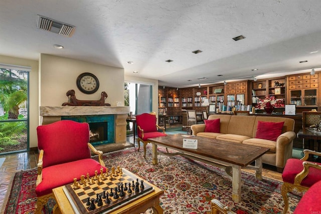 4905 Alicante Way, Oceanside, CA 92056 - living area featuring a fireplace and a textured ceiling