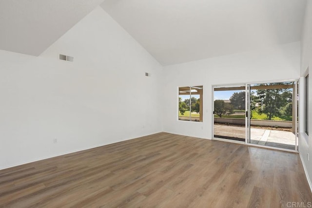 4905 Alicante Way, Oceanside, CA 92056 - unfurnished room featuring high vaulted ceiling and wood finished floors