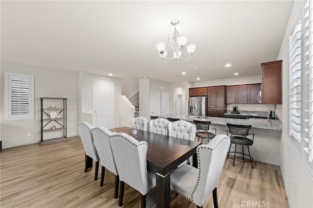 dining area with stairs, recessed lighting, a chandelier, and light wood-type flooring