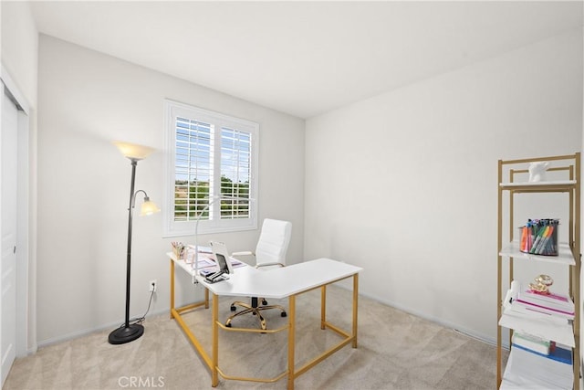 office with light colored carpet and baseboards