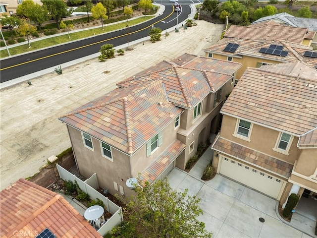 birds eye view of property with a residential view