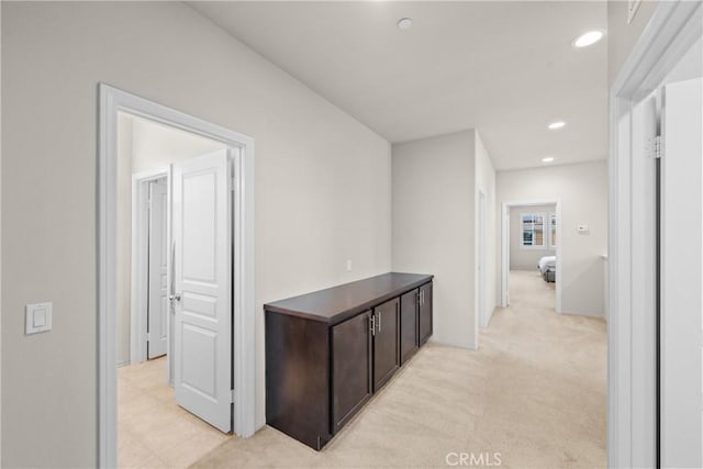 corridor with recessed lighting and light colored carpet