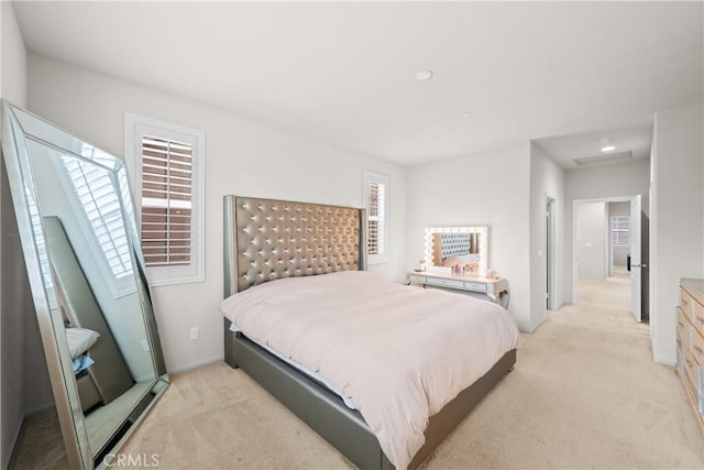 bedroom featuring light carpet
