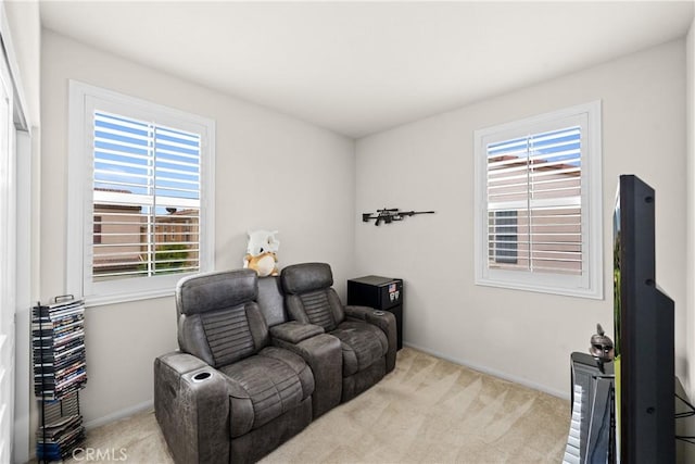 sitting room with carpet flooring and baseboards