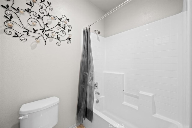 full bathroom with shower / tub combo and toilet