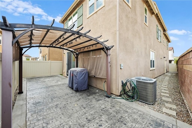 view of parking with a fenced backyard