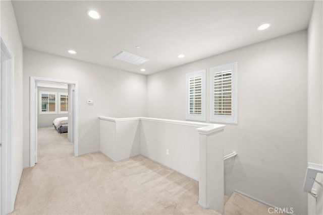interior space featuring recessed lighting and light colored carpet
