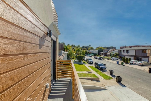 view of street with sidewalks and a residential view