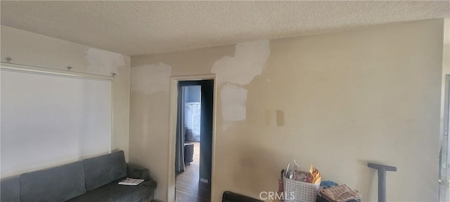 interior space with a textured ceiling
