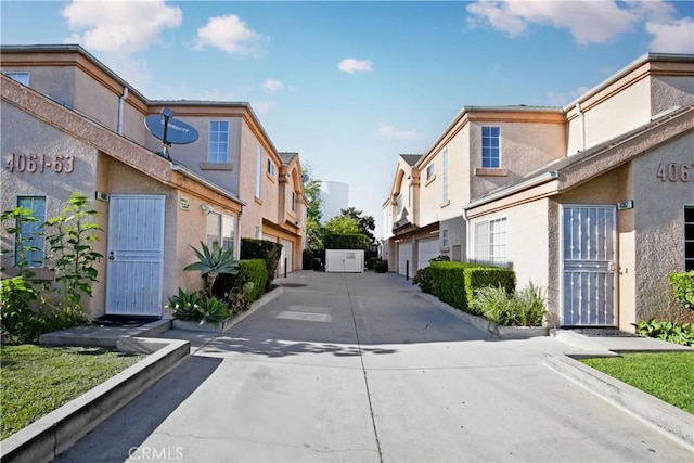 view of concrete road featuring a residential view