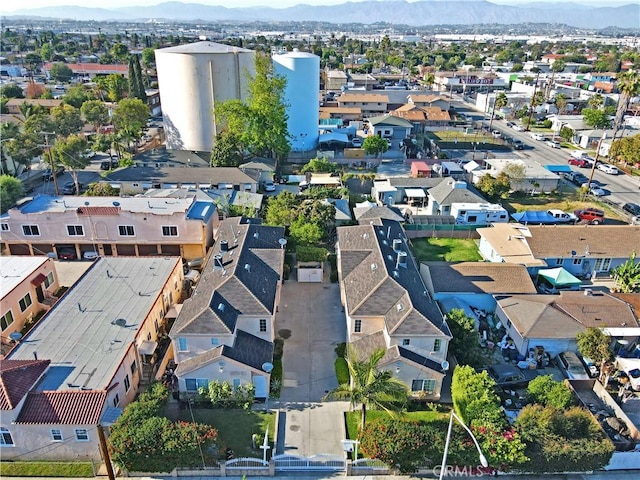 aerial view of residential area featuring mountains