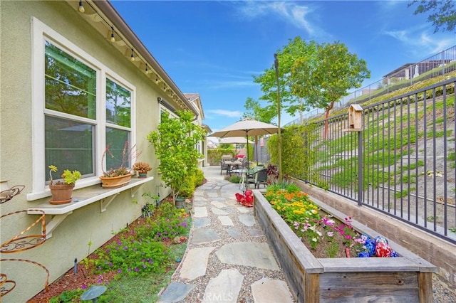 exterior space with a patio and a fenced backyard