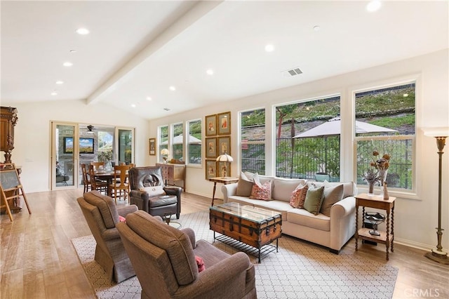 living area featuring recessed lighting, visible vents, lofted ceiling with beams, and light wood-style floors