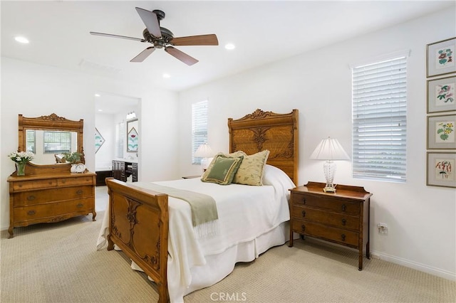 bedroom featuring recessed lighting, ceiling fan, light colored carpet, and baseboards