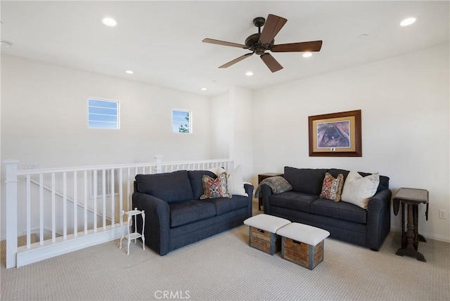 carpeted living room featuring baseboards, ceiling fan, and recessed lighting