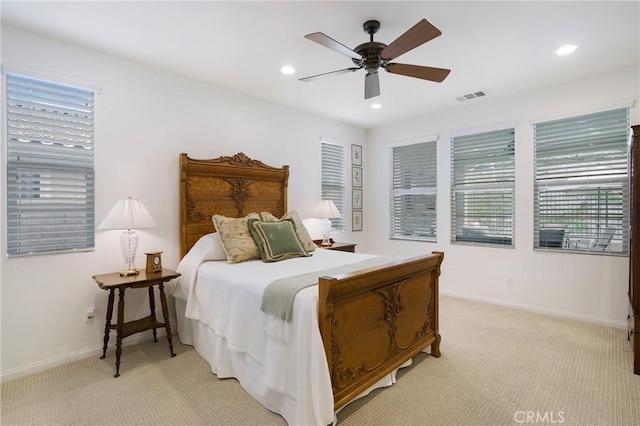 bedroom featuring light carpet, recessed lighting, baseboards, a ceiling fan, and visible vents