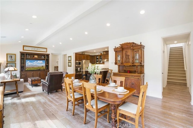 dining area with stairway, recessed lighting, lofted ceiling with beams, and light wood finished floors