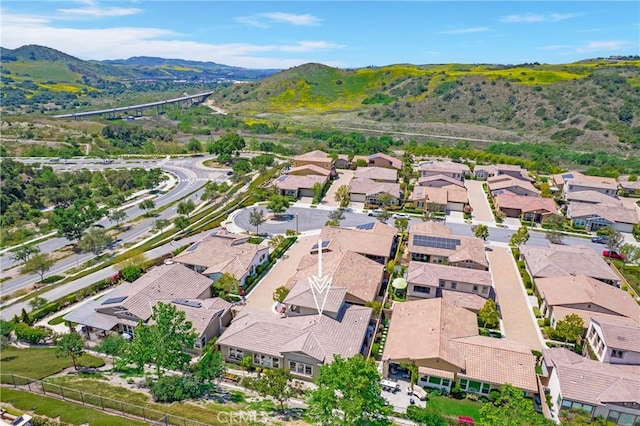aerial view featuring a mountain view and a residential view