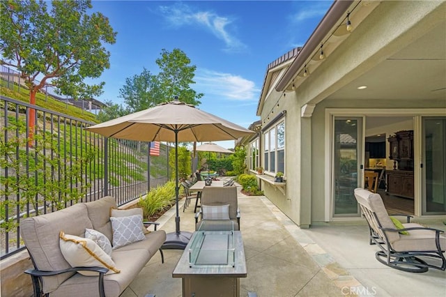 view of patio / terrace with an outdoor hangout area, fence, and outdoor dining area