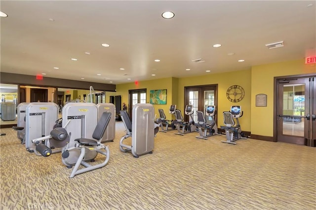 workout area featuring recessed lighting, french doors, and carpet