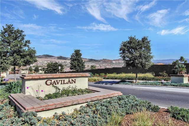 community sign featuring a mountain view