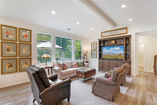 living area featuring lofted ceiling with beams, light wood-style floors, recessed lighting, baseboards, and visible vents