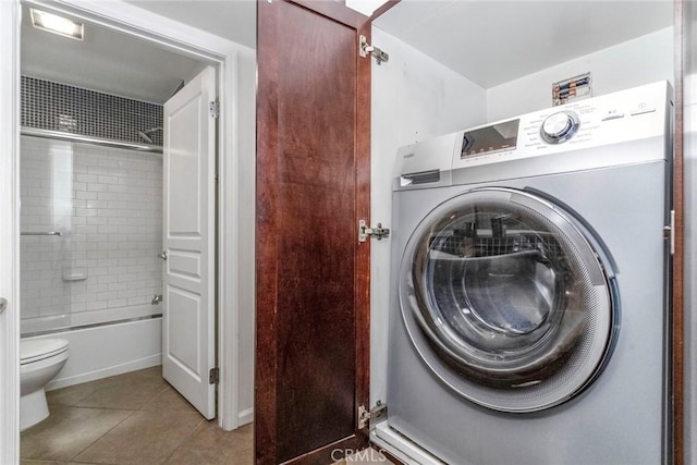 7320 Hawthorn Ave Unit 102, Los Angeles, CA 90046 - laundry area featuring washer / clothes dryer and tile patterned flooring