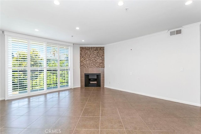 7320 Hawthorn Ave Unit 102, Los Angeles, CA 90046 - unfurnished living room with recessed lighting, tile patterned floors, ornamental molding, and a tiled fireplace