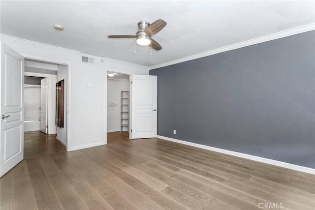7320 Hawthorn Ave Unit 102, Los Angeles, CA 90046 - unfurnished bedroom with ornamental molding, wood finished floors, a spacious closet, ceiling fan, and a closet