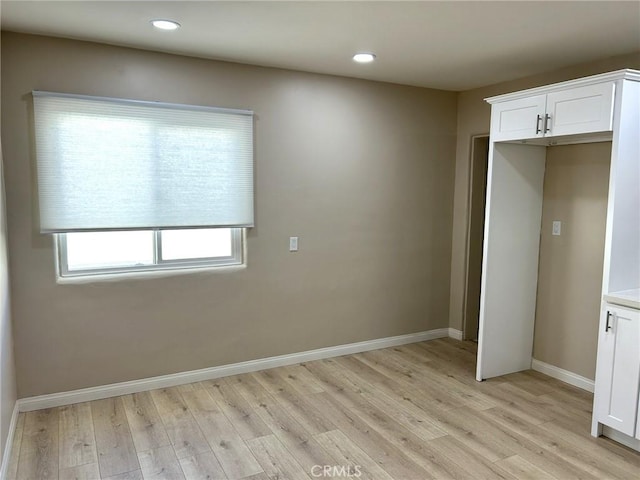 interior space featuring recessed lighting, baseboards, and light wood-type flooring