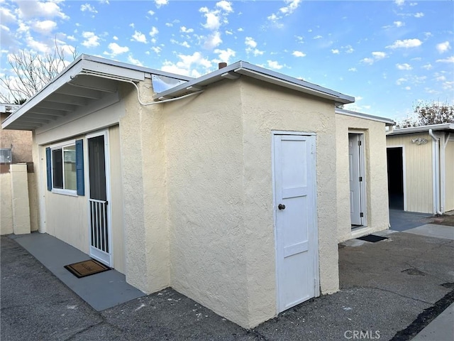 view of property exterior with stucco siding