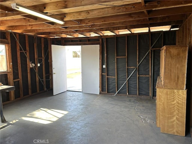 misc room with concrete flooring